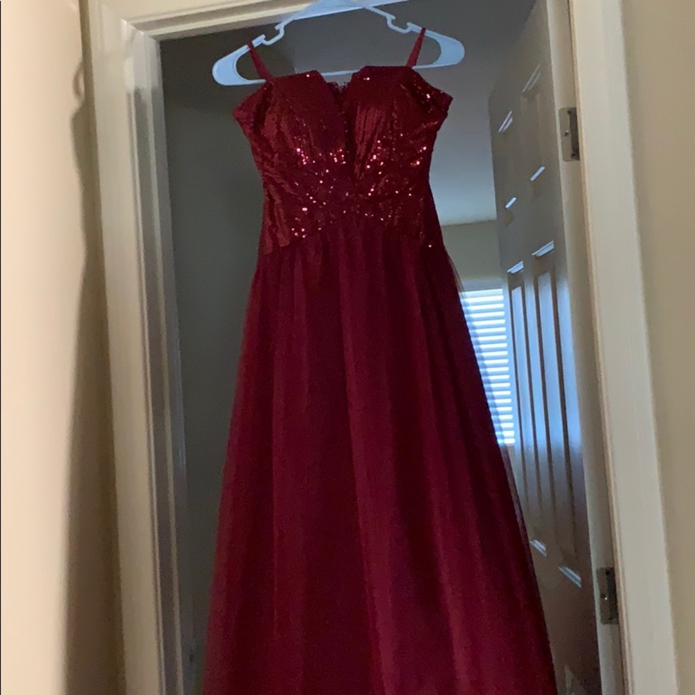 Long prom style dress with sequin top.